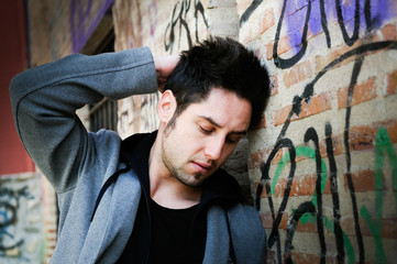 Portrait of handsome man in urban background