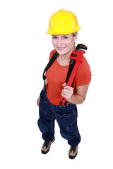 Woman holding a pipe wrench