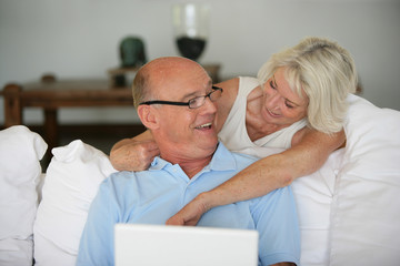 Senior couple with a laptop