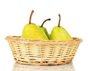 Ripe pears in wicker basket isolated on white