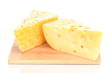 tasty cheese on wooden board isolated on white