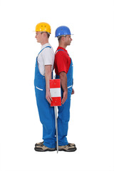 duo of workmen standing back to back isolated on white