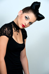 Naklejka premium Beautiful woman with a bow from hair on a head