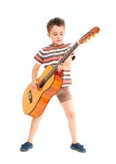 Little boy plays acoustic guitar