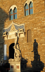 Obraz premium facade of Palazzo Vecchio in Florence at sunset light and Hercul