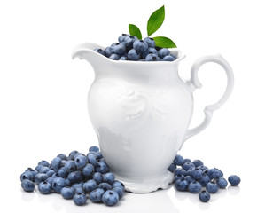 White jug full of blueberries