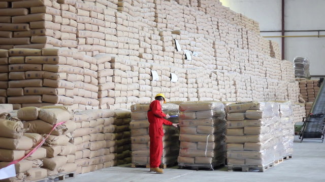 Worker controls of sugar in bags