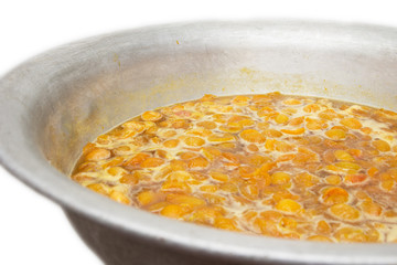 apricot jam in the background