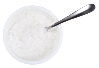spoon in tub of cottage cheese
