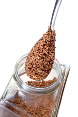 spoon in glass pot with instant coffee