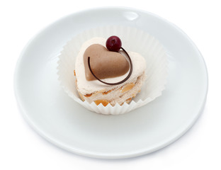 Chocolate moose cake on a white plate. Valentines day