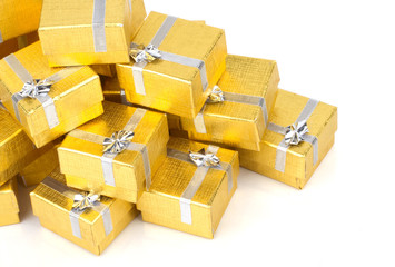 Top view of towel of gold gift boxes