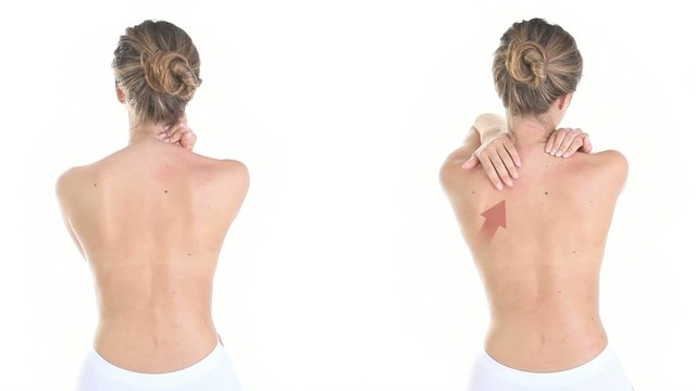 woman massaging her back, shoulders, neck