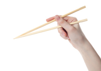 Hand holds the chopsticks, isolated