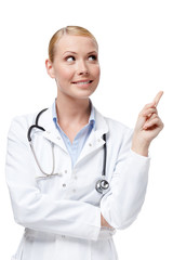 Fototapeta premium Doctor makes a pointing finger gesture, isolated on white
