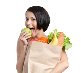 Lovely girl eats a green apple