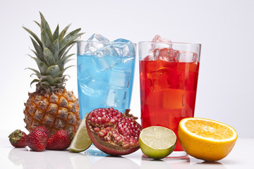 Exotic alcohol drinks set with fruits