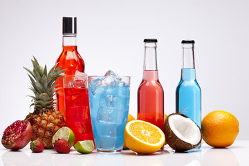 Exotic alcohol drinks set with fruits