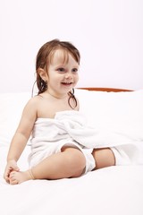 Happy little girl in towel after a relaxing bath © George Serban