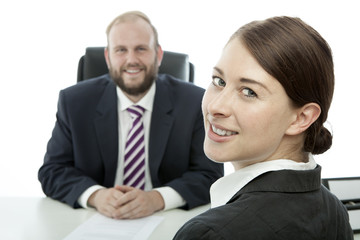 Fototapeta premium beard business man brunette woman at desk smiling