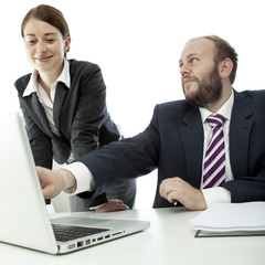 Fototapeta premium beard business man brunette woman at desk point laptop