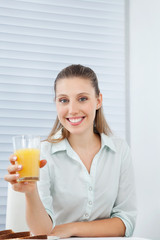 Happy Businesswoman Holding Orange Juice