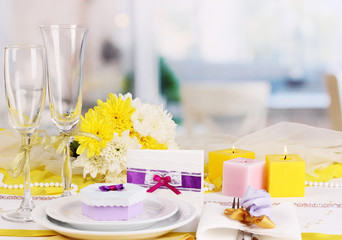 Serving fabulous wedding table in purple and yellow color of