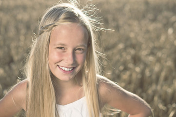 Smiling Blond Girl in Nature