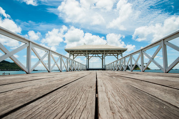 A Beautiful wooden pier with blue sky background