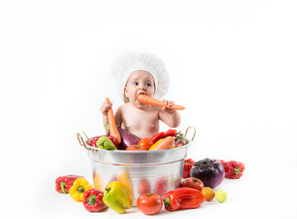 Bambino dentro la pentola con cappello da cuoco