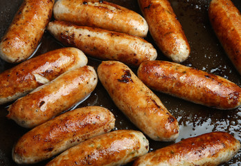Sausages Cooking in Frying Pan