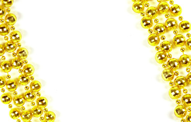 Background made of a brilliant celebratory beads of golden color