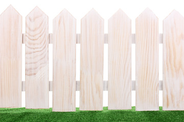 wooden fence and green grass isolated on white.