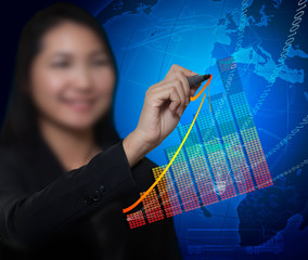 business woman drawing growth trend line