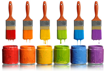 Paintbrushes Dripping into Paint Containers