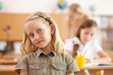 Little girl at school class