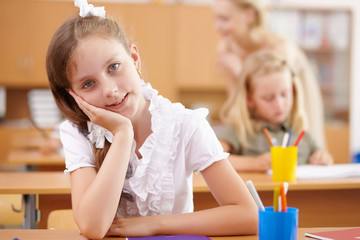 Little girl at school class