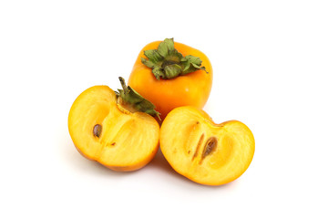 Half of persimmon fruits on white background