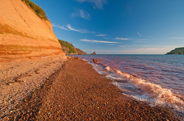 Red Waves on a Red Sandstone Beach