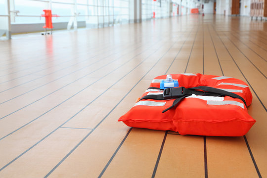 Singular  life jacket lies on deck of cruise passenger liner