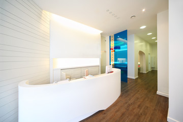 Lit reception area in dental clinic.