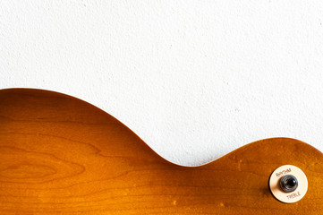Pattern wood of electric guitar with white wall