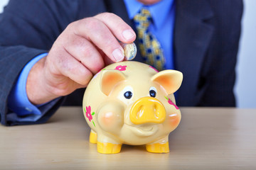 Man's money in his piggy bank