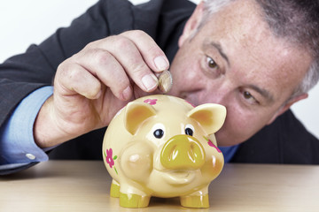 Man's money in his piggy bank