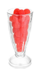 Color candies in glass isolated on white