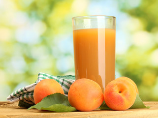 glass of apricot juice and fresh apricots