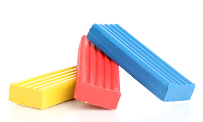 Children bright plasticine isolated on white