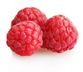 ripe raspberries isolated on white