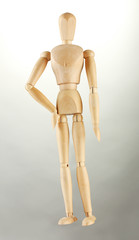 wooden mannequin, on grey background