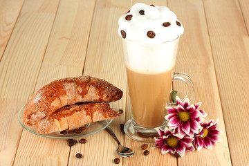 glass of fresh coffee cocktail and saucer with bagels